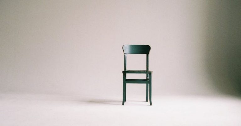 Minimalism - Wooden Chair on a White Wall Studio