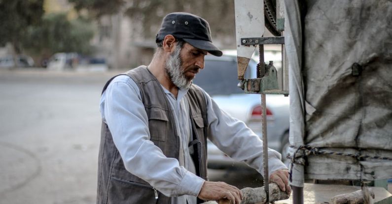 Table Saw - A Man Cutting a Wood with a Table Saw