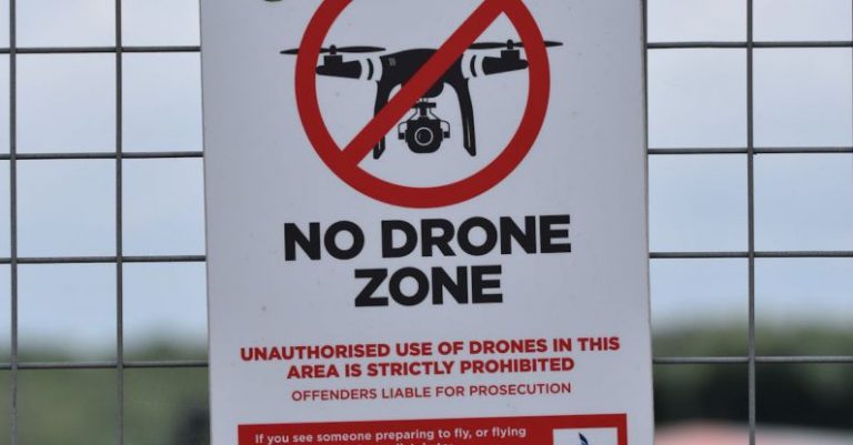 Safety Measures - No Drone Zone Signage on the Fence