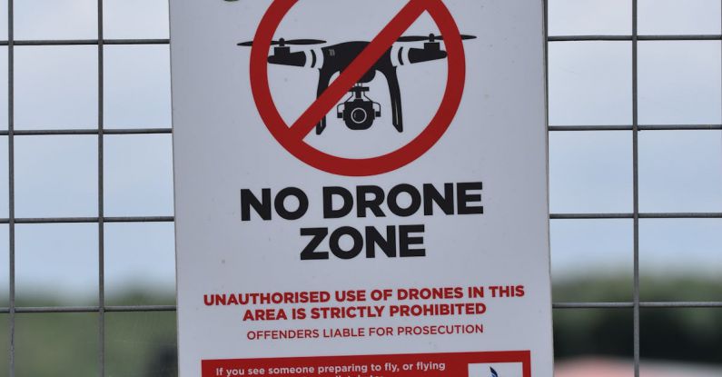 Safety Measures - No Drone Zone Signage on the Fence